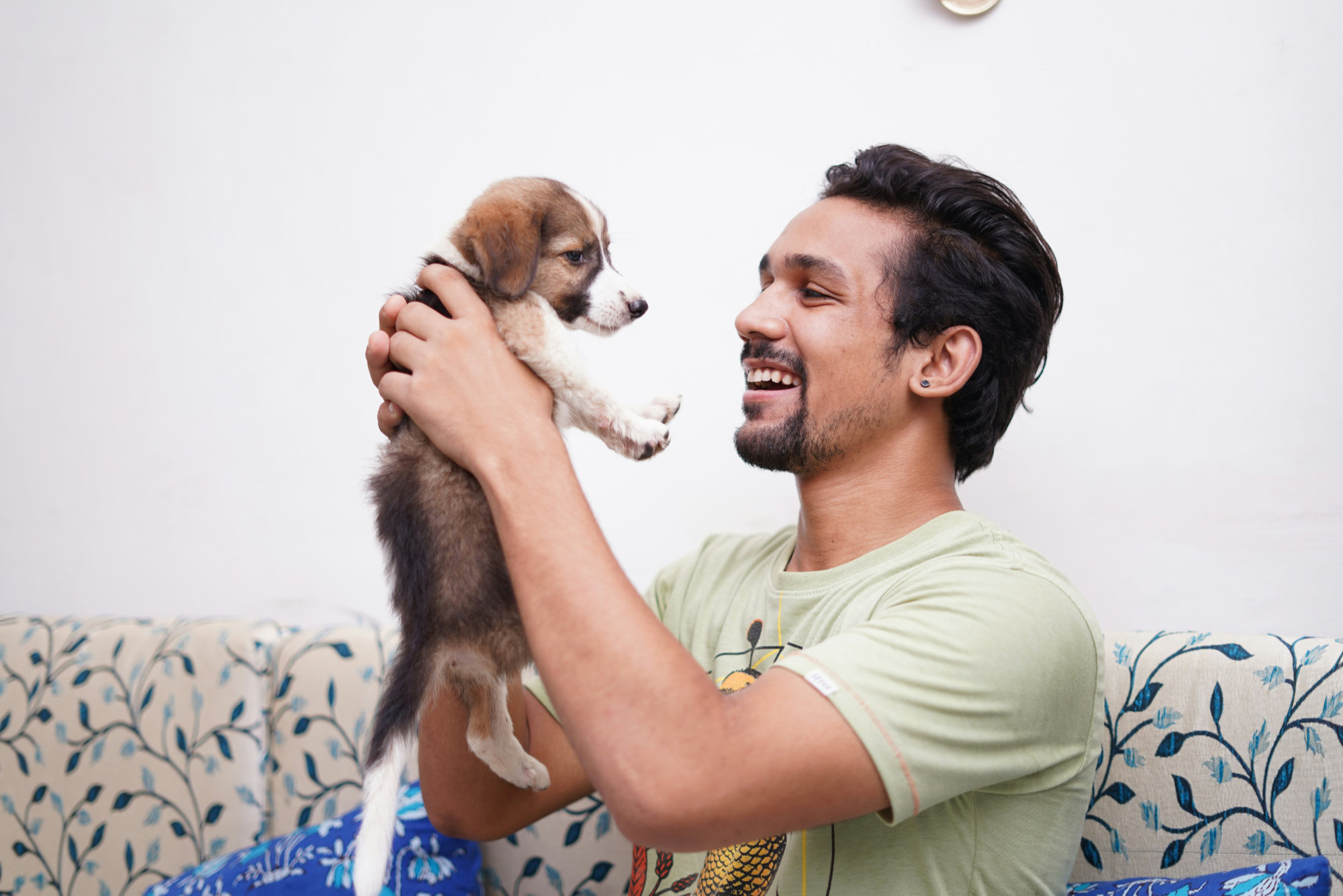 man-smiling-with-puppy